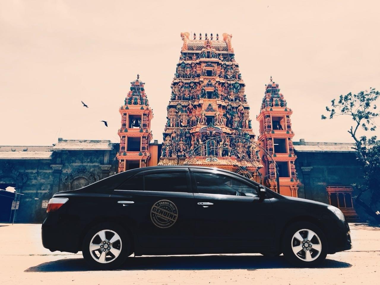 Colombo Day Tours private sedan parked outside a colourful Hindu kovil temple in Colombo